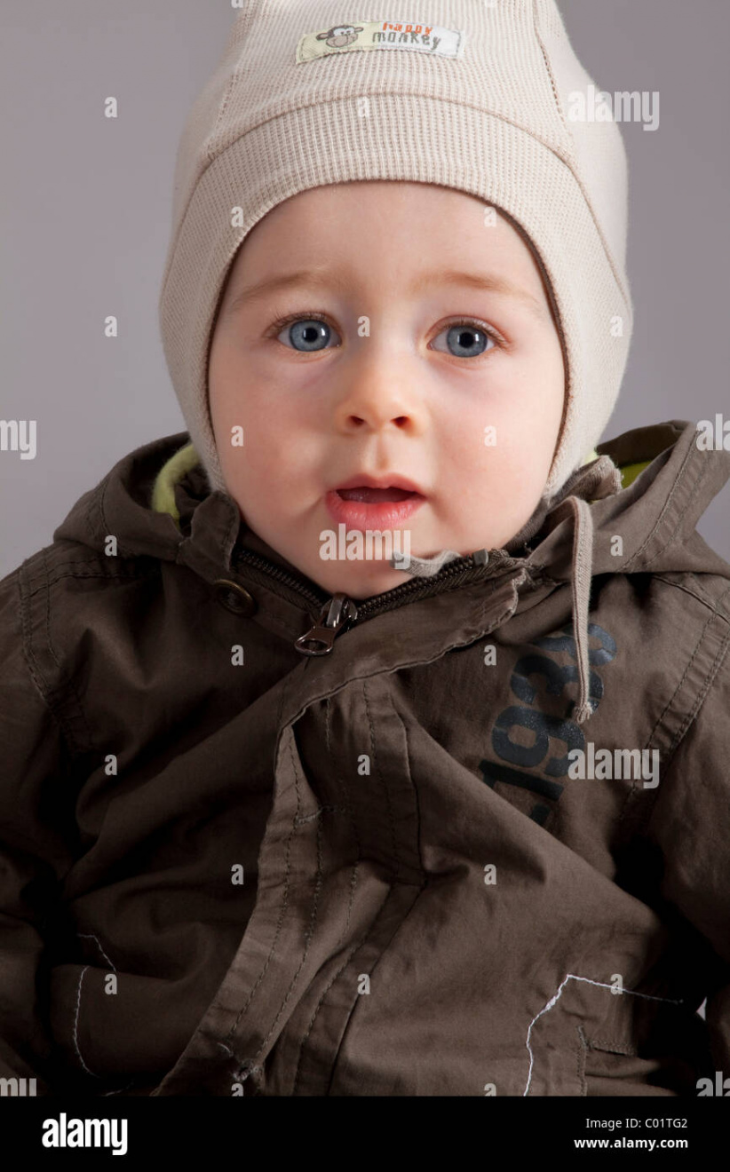 Baby in winter clothes, boy,  months, portrait Stock Photo - Alamy