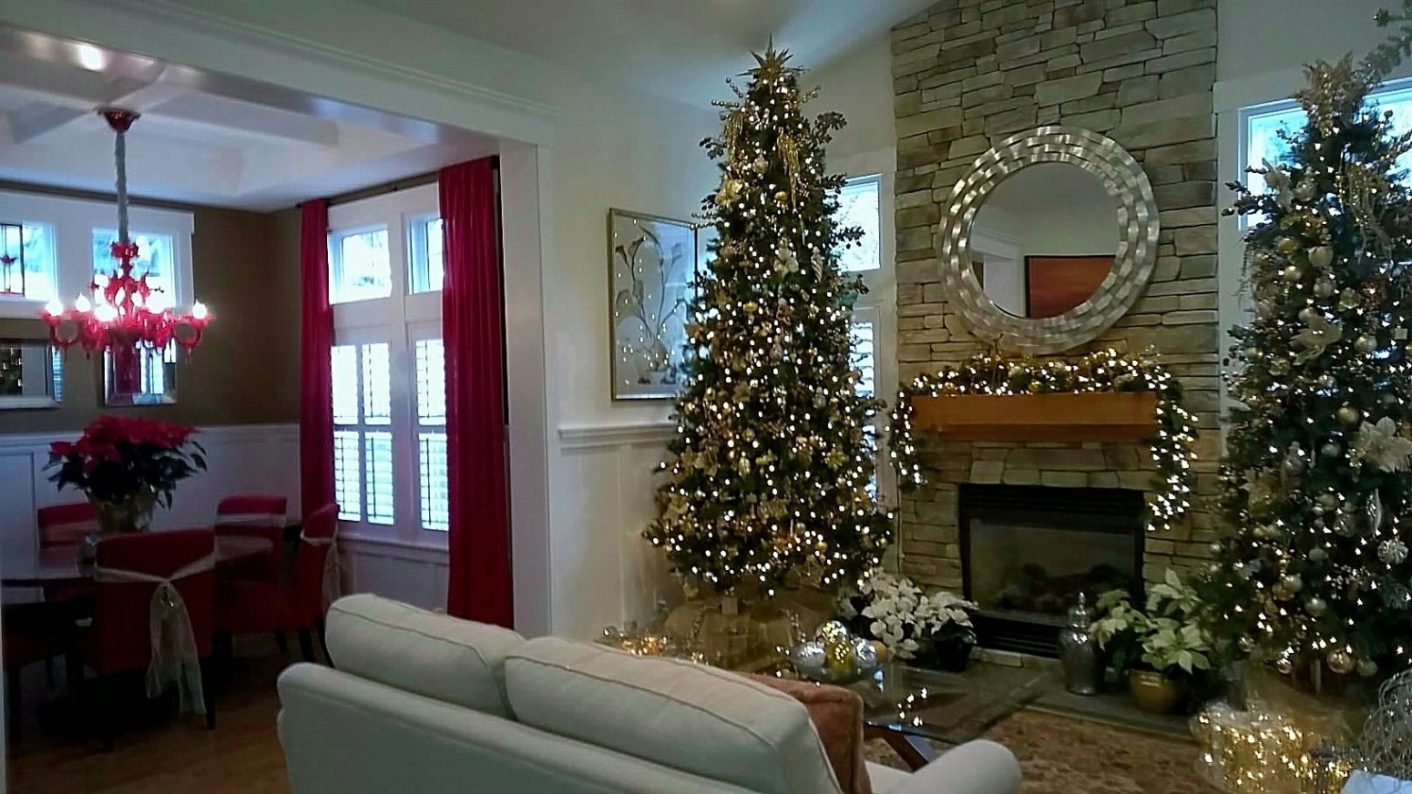 Two Christmas trees in Living Room decorated all in gold