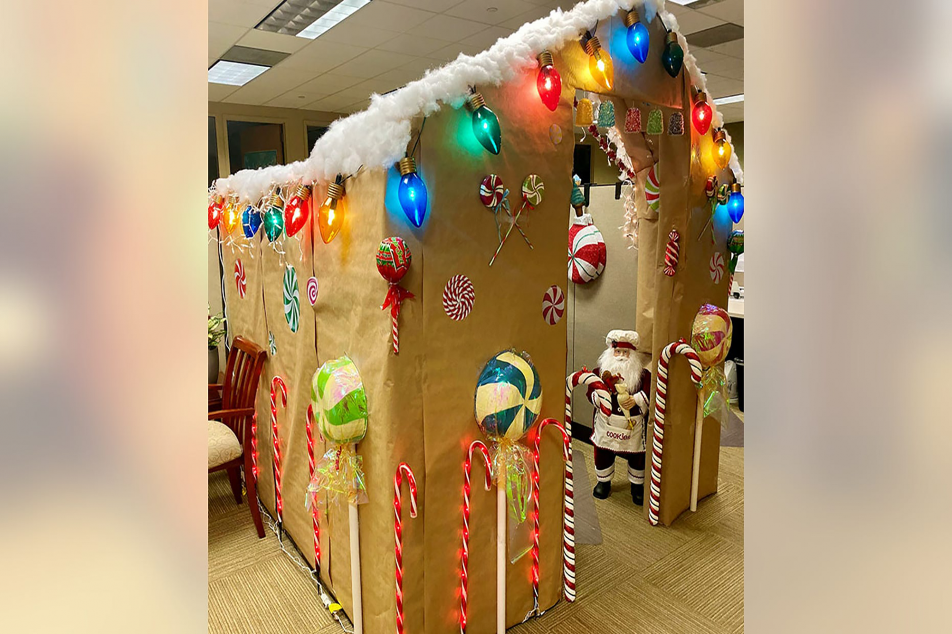 Woman turns office cubicle into gingerbread house for Christmas