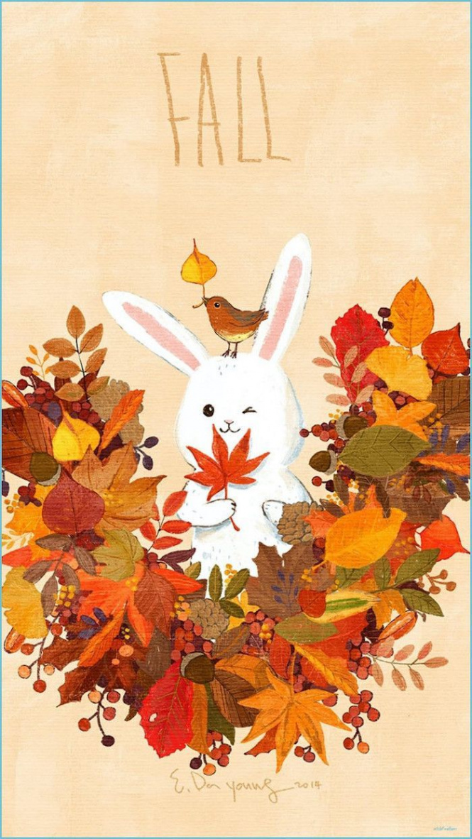 bunny drawing surrounded by orange green red yellow brown leaves